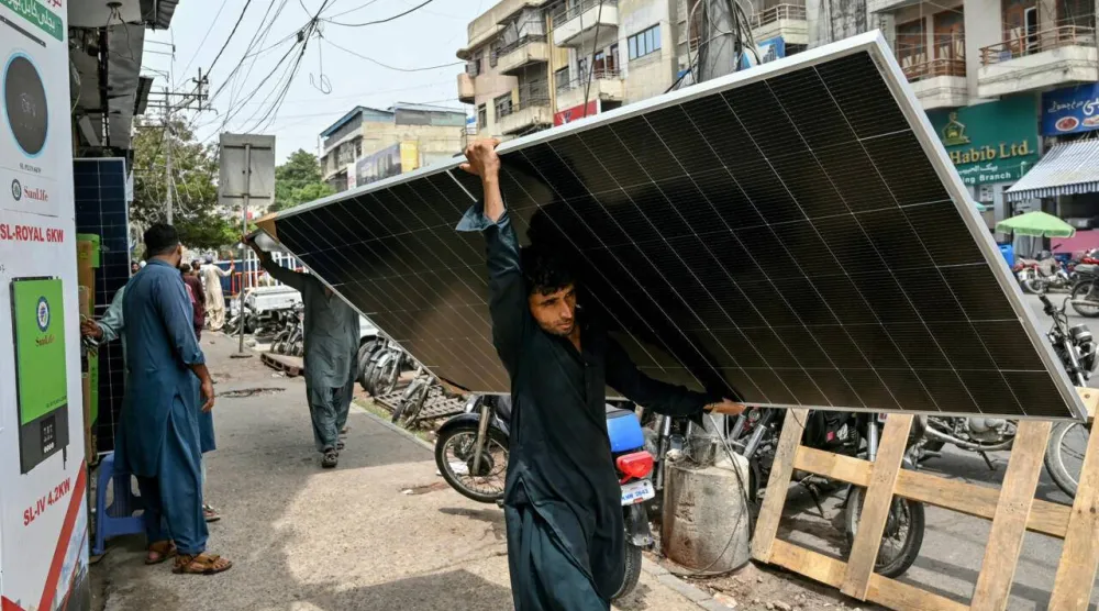 Pakistanis are increasingly ditching the national grid in favor of solar power, prompting a boom in rooftop panels. Asif HASSAN / AFP
