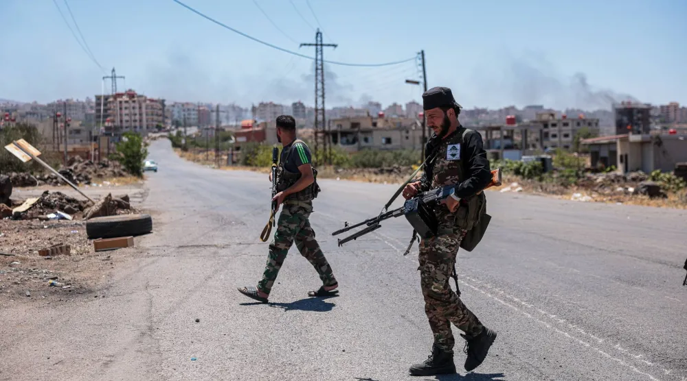 Syrian security forces deploy amid ongoing clashes in the southern city of Sweida, 16 July 2025. EPA/MOHAMMED AL RIFAI