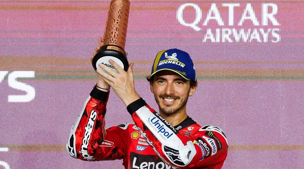 Third-placed Aprilia Racing's Spanish rider Jorge Martin celebrates on the podium at the end of the Qatar MotoGP Grand Prix at the Lusail International Circuit in Lusail, north of Doha on April 13, 2025. (AFP)