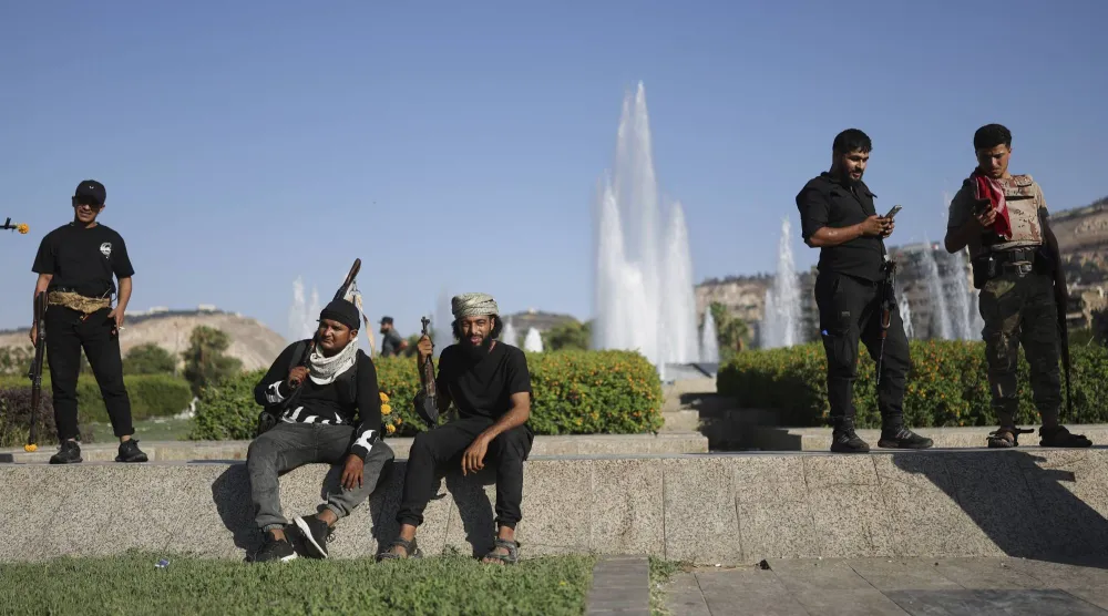 Bedouin fighters from various provinces gather at Umayyad Square in Damascus, Syria, Saturday, July 19, 2025, before heading to the southern province of Sweida to join clashes between Bedouin clans and Druze fighters. (AP Photo/Ghaith Alsayed)