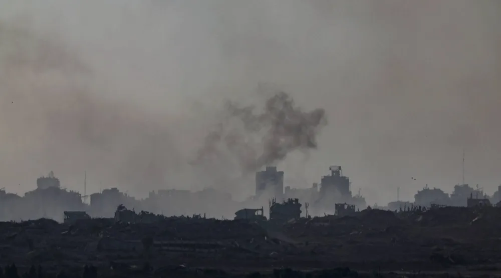 Smoke rises as a result of an explosion in the northern part of the Gaza Strip, as seen from the Israeli side of the border with Gaza, in southern Israel, 07 August 2025. EPA/ATEF SAFADI