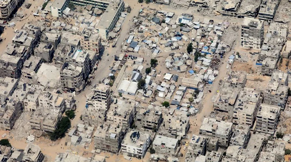  An aerial view from a Jordanian military aircraft shows the Gaza Strip, before humanitarian aid is airdropped over it, in Gaza, August 9, 2025. (Reuters)