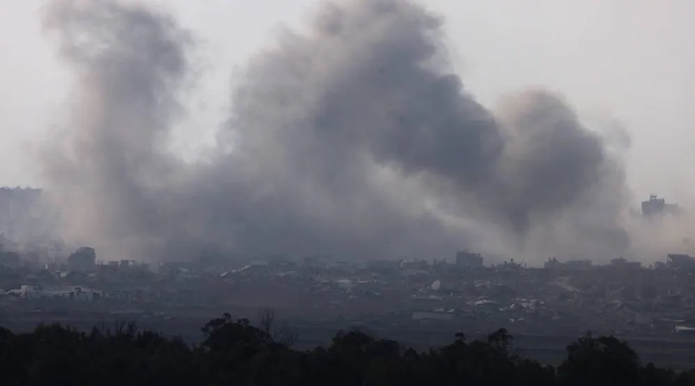 This picture taken from a position on the Israeli border with the Gaza Strip, shows smoke rising during an Israeli strike on the besieged Palestinian territory on August 10, 2025. (AFP)