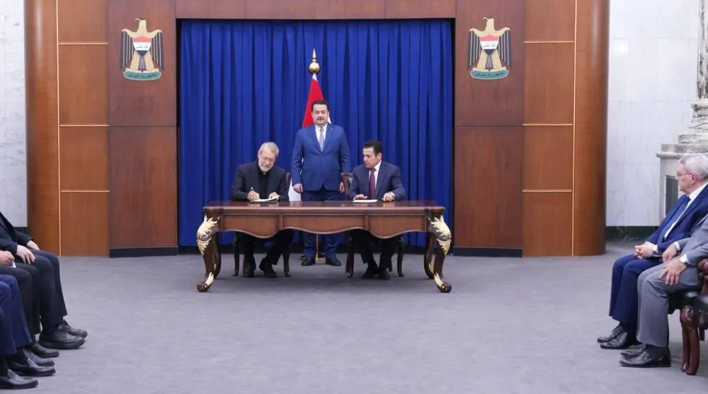 السوداني يشرف على توقيع الأعرجي ولاريجاني مذكرة تفاهم لتنسيق التعاون الحدودي بين العراق وإيران (رئاسة الوزراء العراقية)