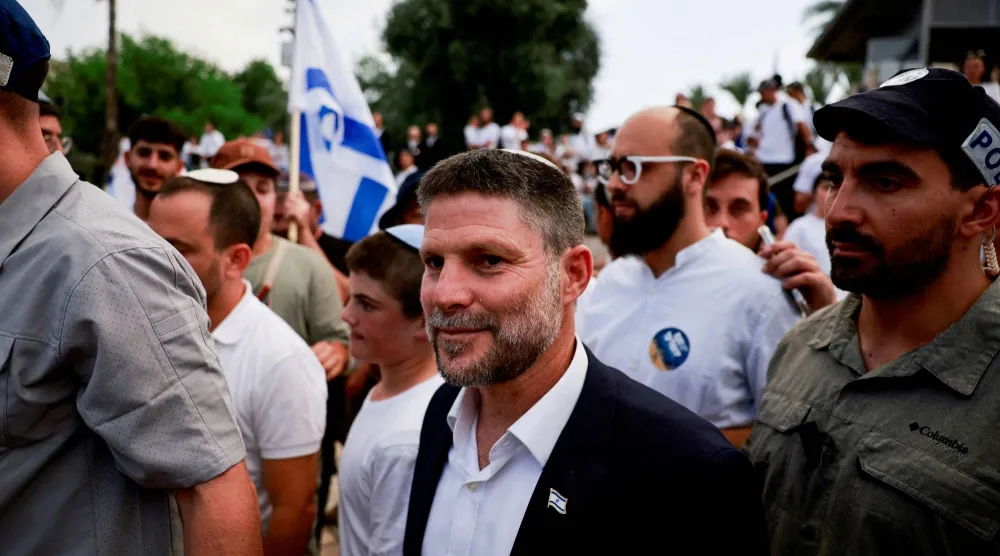 FILE PHOTO: Israeli Finance Minister Bezalel Smotrich walks to visit the Damascus Gate to Jerusalem's Old City, as Israelis mark Jerusalem Day, in Jerusalem May 26, 2025. REUTERS/Ammar Awad/File Photo