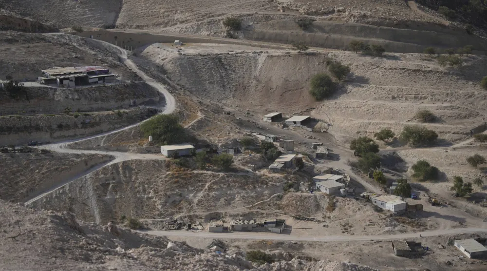 Palestinian hamlets are seen at the E1 area, an open tract of land east of Jerusalem, between the Israeli settlement of Maale Adumim and the occupied West Bank town of Eizariya Thursday, Aug. 14, 2025. (AP Photo/Nasser Nasser)
