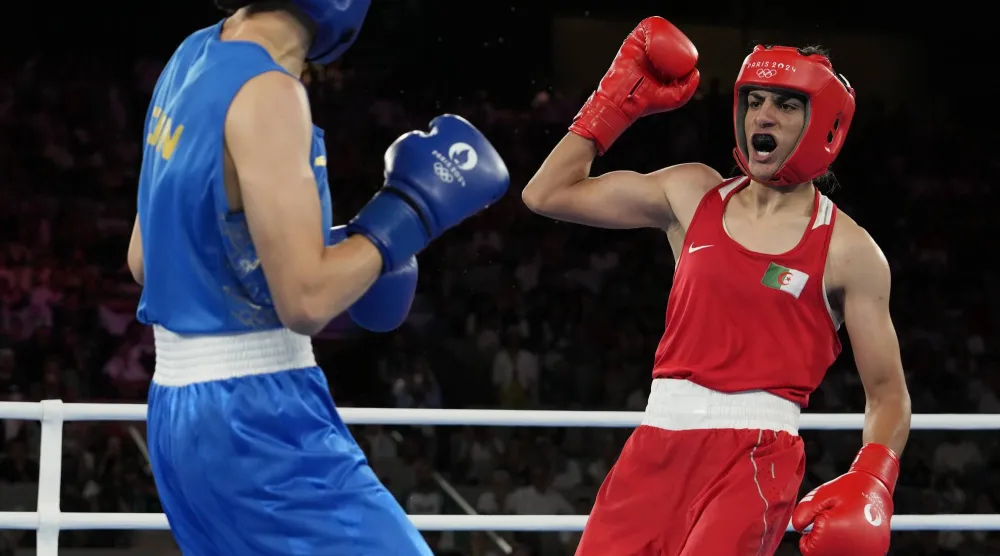 FILE - Algeria's Imane Khelif, right, fights China's Yang Liu in their women's 66 kg final boxing match at the 2024 Summer Olympics, Friday, Aug. 9, 2024, in Paris, France. (AP Photo/Ariana Cubillos, File)