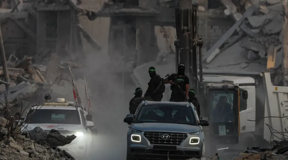 Fighters from the Qassam Brigades, Hamas’s military wing, in Gaza City’s Al Shujaiya district, November 5, 2025 (EPA)