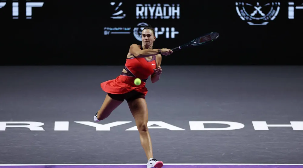 Tennis - WTA Finals - Riyadh - King Saud University Indoor Arena, Riyadh, Saudi Arabia - November 6, 2025 Belarus' Aryna Sabalenka in action during her group stage match against Coco Gauff of the US. REUTERS/Hamad I Mohammed