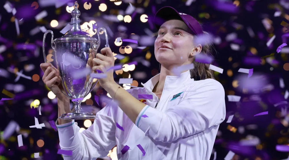 Tennis - WTA Finals - Riyadh - King Saud University Indoor Arena, Riyadh, Saudi Arabia - November 8, 2025 Kazakhstan's Elena Rybakina celebrates with the trophy after winning the final match against Belarus' Aryna Sabalenka REUTERS/Stephanie Lecocq