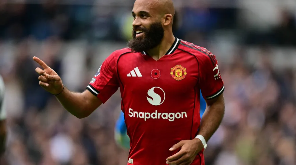 Manchester United's Cameroonian midfielder #19 Bryan Mbeumo celebrates after scoring the opening goal of the English Premier League football match between Tottenham Hotspur and Manchester United at the Tottenham Hotspur Stadium in London, on November 8, 2025. (AFP) 