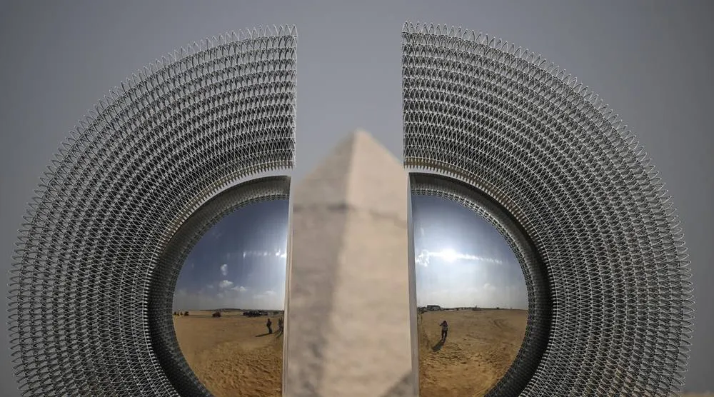 An art installation, "The Shen" by Mert Ege Kose, is displayed near the Giza pyramid complex, in Giza, Egypt, 11 November 2025. (EPA)