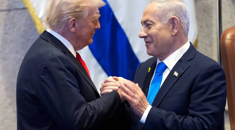 President Donald Trump talks with Israel's Prime Minister Benjamin Netanyahu at the Knesset, Monday, Oct. 13, 2025, in Jerusalem. (Reuters) 