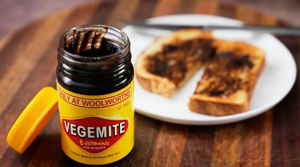 A piece of toast is prepared with Vegemite in Sydney, Australia, Monday, Nov. 17, 2025. (AP) 