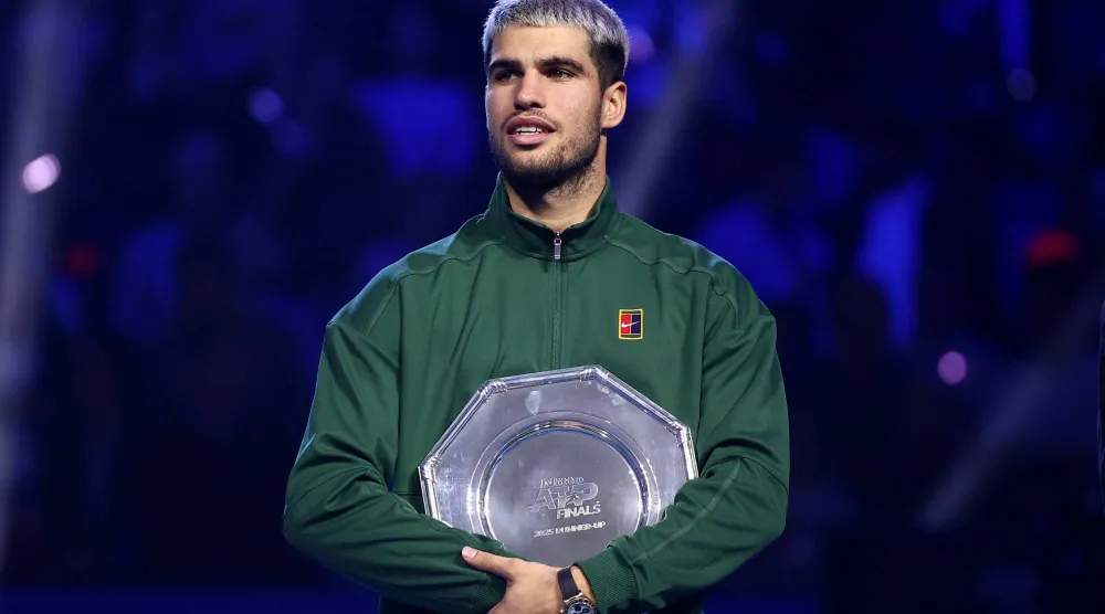 Tennis - ATP Finals - Turin - Palasport Olimpico, Turin, Italy - November 16, 2025 Spain's Carlos Alcaraz with the runners up trophy after losing the final against Italy's Jannik Sinner. (Reuters)