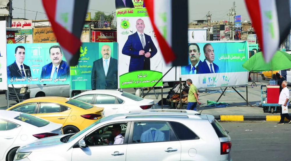 لافتات دعائية في بغداد من حملة الانتخابات العراقية (أ.ف.ب)