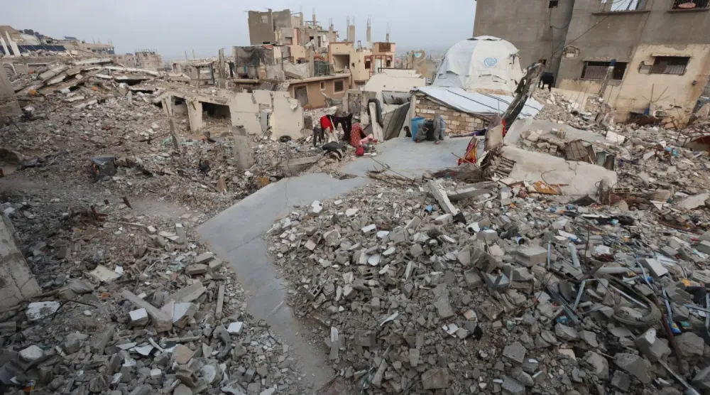 İsrail'in Gazze Şeridi'ne düzenlediği hava saldırılarının yol açtığı yıkımdan bir kare (Reuters)