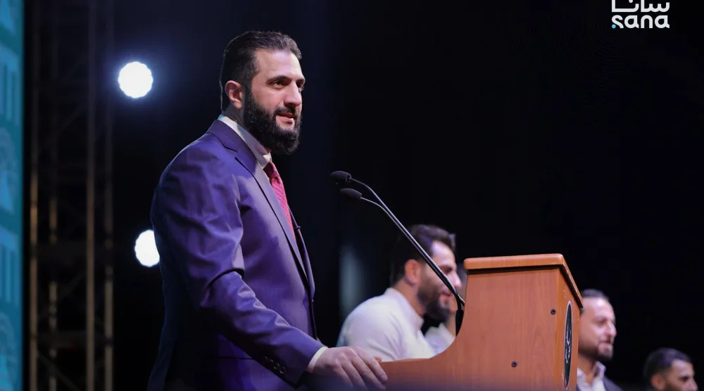 الشرع خلال إلقائه كلمته (سانا)