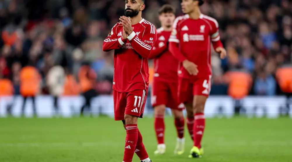 Mohamed Salah of Liverpool (L) greets their supporters after the English Premier League match between Liverpool and Sunderland in Liverpool, Great Britain, 03 December 2025.  EPA/ADAM VAUGHAN