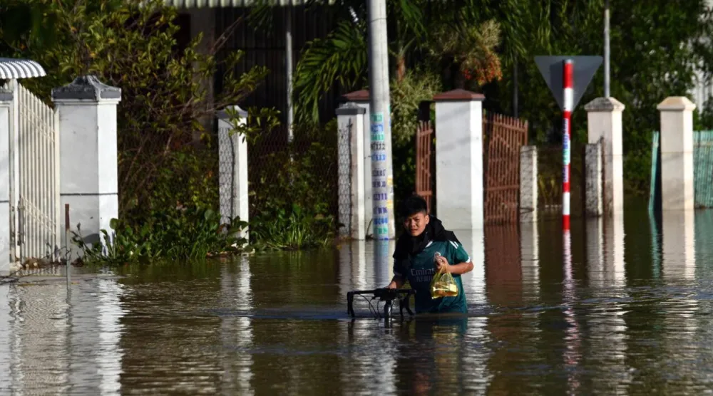 Deadly flooding inundated thousands of homes in Vietnam's Lam Dong province in what authorities say is a record-breaking year of natural disasters. Quoc Nguyen / AFP
