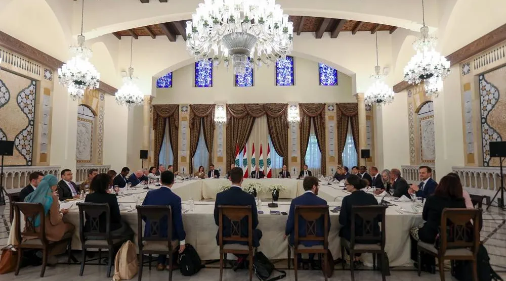 Lebanese Prime Minister Nawaf Salam, in front of the Lebanese flags (C), meets with a United Nations Security Council delegation at the government palace in Beirut, Lebanon, 05 December 2025. (EPA)