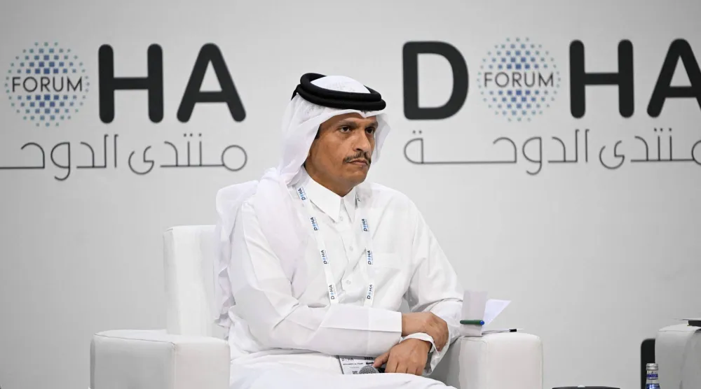 Qatar's Prime Minister and Minister for Foreign Affairs Sheikh Mohammed bin Abdulrahman bin Jassim Al-Thani, attends a session on the opening day of the Doha Forum, an annual diplomatic conference, in Doha on December 6, 2025. (Photo by MAHMUD HAMS / AFP)