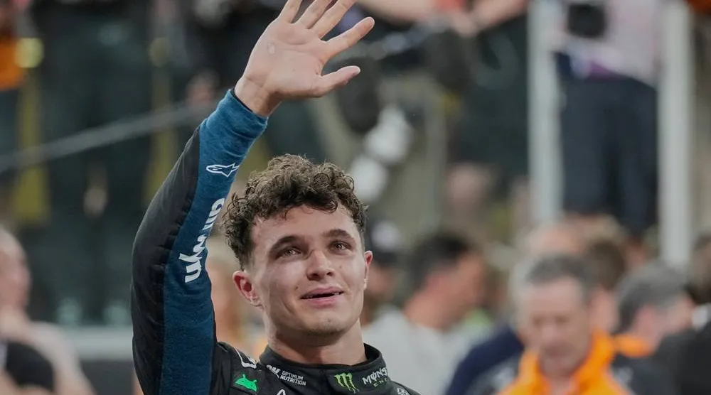  McLaren driver Lando Norris of Britain reacts after becoming a world champion after the Abu Dhabi Formula One Grand Prix in Abu Dhabi, United Arab Emirates, Sunday, Dec. 7, 2025. (AP)