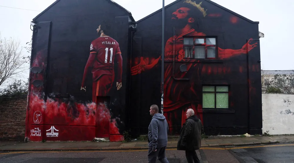 محمد صلاح في كل مكان في ليفربول (رويترز)