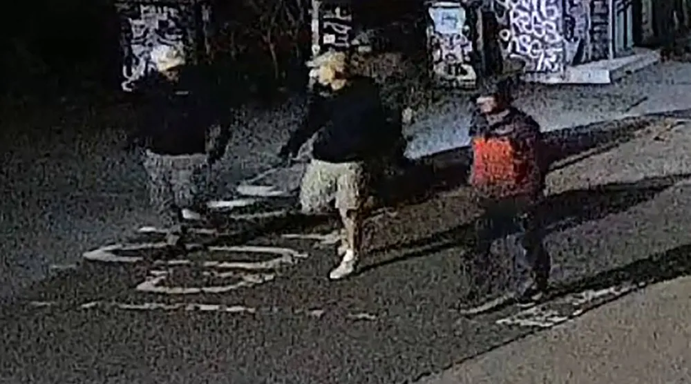 This handout image of CCTV footage released by Avon and Somerset Police on December 11, 2025 shows men in the early hours of September 25 in the city of Bristol, south-west England outside a building which housed items from the Bristol Museum's British Empire and Commonwealth collection. (Photo by Handout / Avon and Somerset Police / AFP)