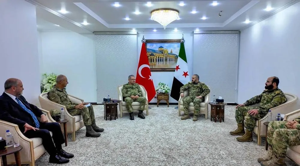 Turkish Land Forces Commander Metin Tokel and Syrian Defense Minister Murhaf Abu Qasra meet in Damascus on December 11. (Turkish Defense Ministry) 