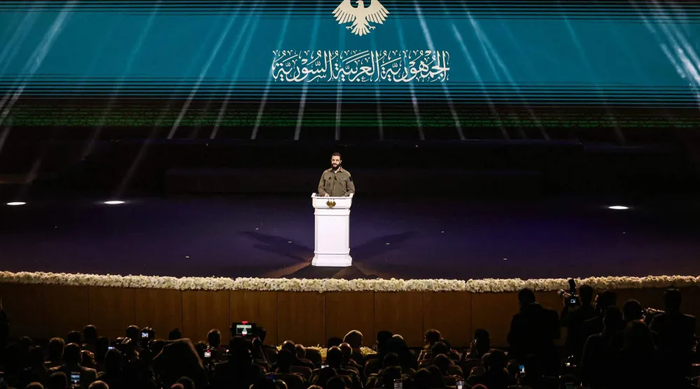 الرئيس السوري خلال مشاركته في ذكرى إسقاط النظام السابق بدمشق يوم 8 ديسمبر الجاري (أ.ف.ب)