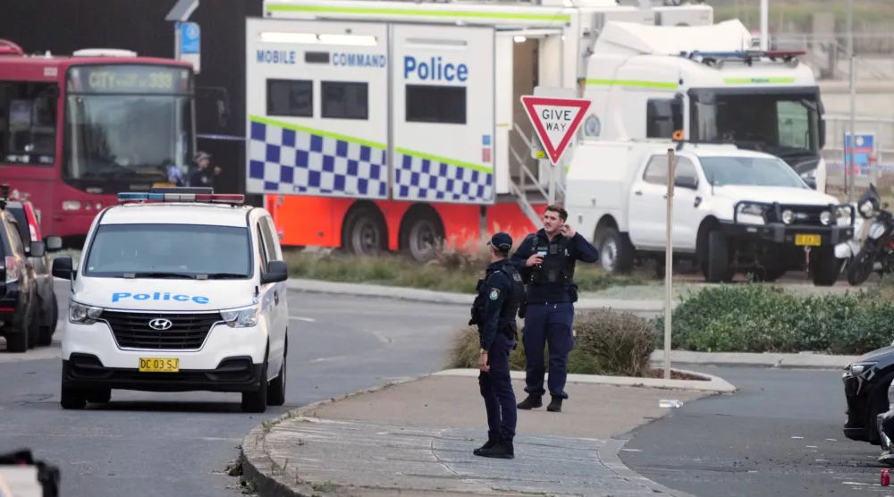 Police patrol in the early morning following a shooting Sunday at Sydney's Bondi Beach, Monday, Dec. 15, 2025. (AP Photo/Mark Baker)
