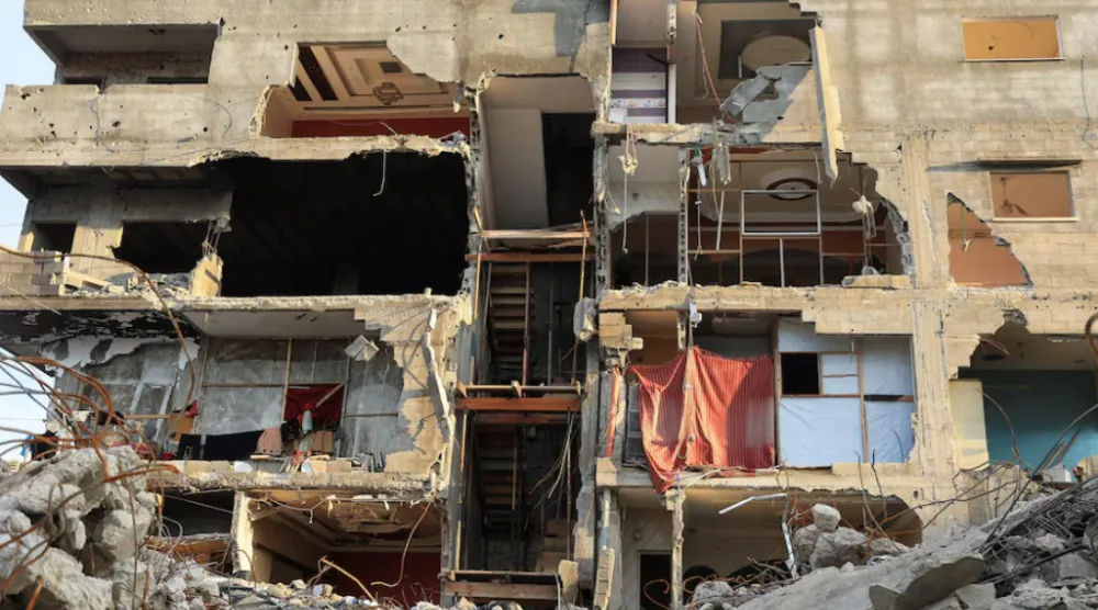 A general view of a residential building damaged during the war, in Gaza City, December 14, 2025. REUTERS/Dawoud Abu Alkas 