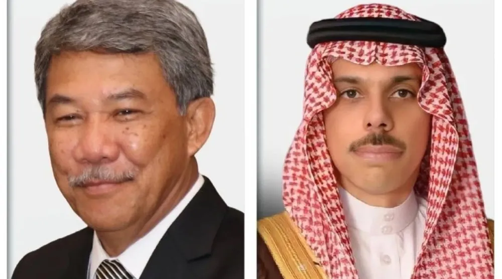 الأمير فيصل بن فرحان والوزير محمد حسن (الخارجية السعودية)