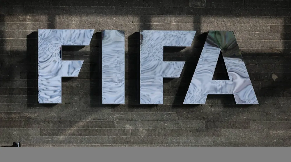 13 December 2024, Switzerland, Zurich: The FIFA logo is seen on the façade of FIFA headquarters before the draw ceremony for the 2026 FIFA World Cup qualifiers. (dpa)