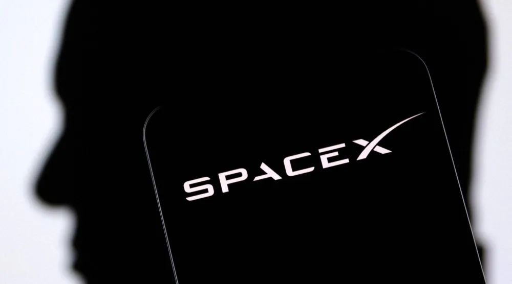 FILE PHOTO: SpaceX logo and Elon Musk silhouette are seen in this illustration taken, December 19, 2022. REUTERS/Dado Ruvic/Illustration/File Photo