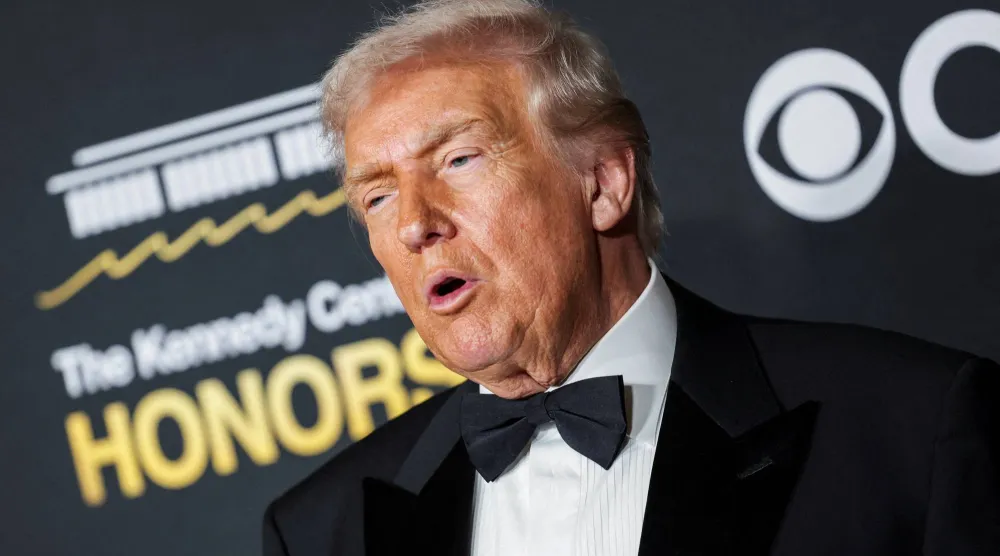 FILE PHOTO: US President Donald Trump poses on the red carpet for the 2025 Kennedy Center Honors at the John F. Kennedy Center for the Performing Arts in Washington, D.C., US, December 7, 2025. REUTERS/Jeenah Moon/File Photo