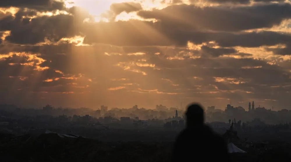  A Palestinian looks over an area of buildings destroyed during Israeli air and ground operations at sunset in northern Nuseirat, central Gaza Strip, Friday, Dec. 19, 2025. (AP) 