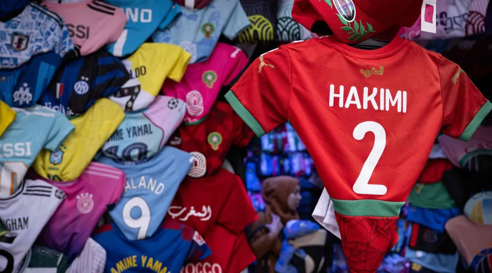 Morocco defender Achraf Hakimi's jersey is displayed in a shop in Rabat, on December 19, 2025, ahead of the Africa Cup of Nations (AFCON). 2 ACHRAF HAKIMI (Photo by SEBASTIEN BOZON / AFP)