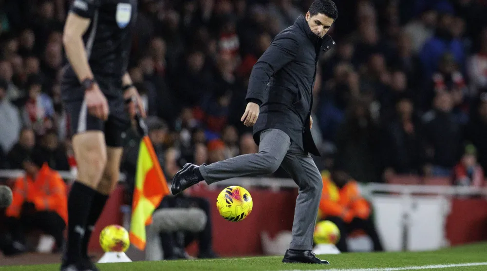Arsenal manager Mikel Arteta kicks back a ball during the English Premier League match between Arsenal FC and Wolverhampton Wanderers, in London, Britain, 13 December 2025.  EPA/TOLGA AKMEN