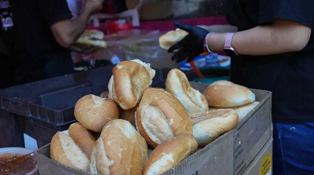 Bolillos, a traditional Mexican bread, sit for sale at a street stand in Mexico City, Thursday, Dec. 18, 2025. (AP Photo/Marco Ugarte)