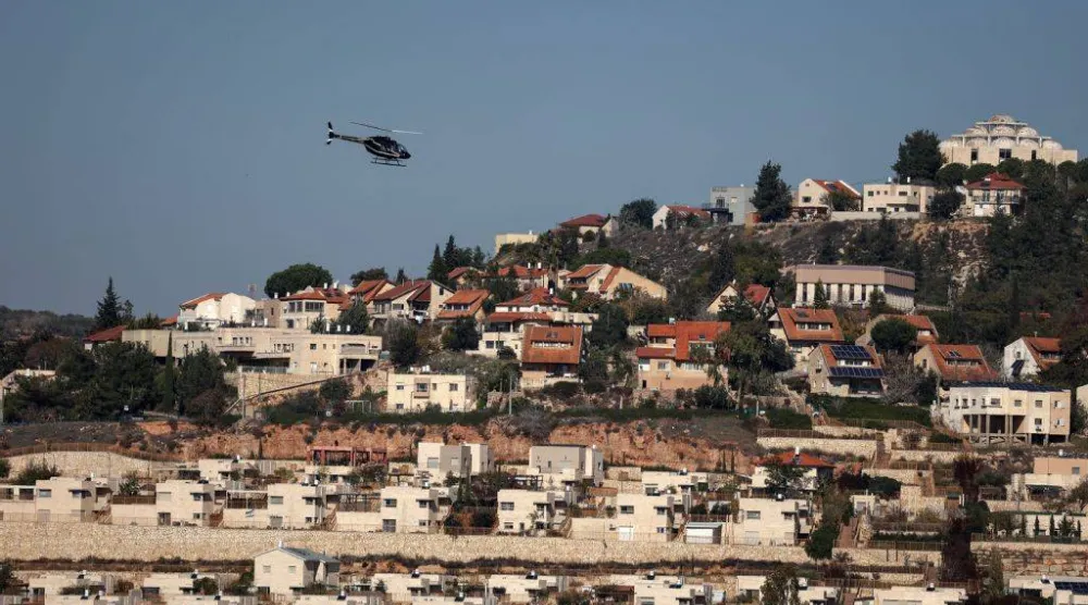  A helicopter flies over the Israeli settlement of Shilo in the occupied West Bank on December 14, 2025. (AFP) 