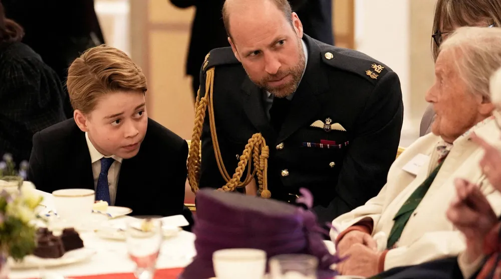 Britain's Prince William, Prince of Wales and Prince George join Second World War veterans at a tea party in Buckingham Palace, central London, following the military procession to mark the 80th anniversary of VE Day, May 5, 2025. (Reuters)