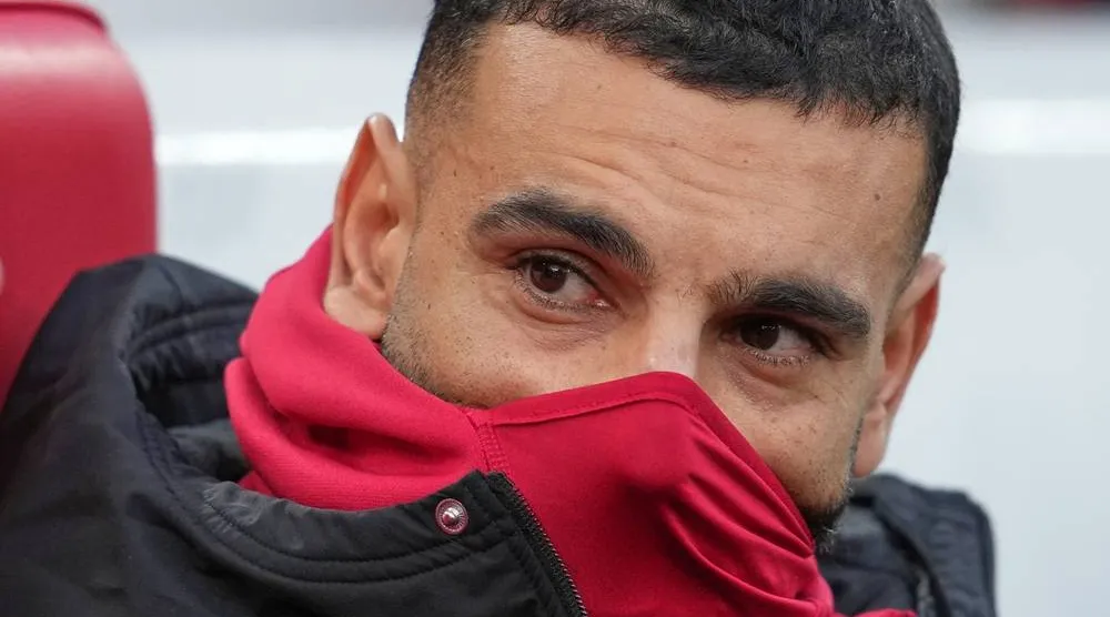 Liverpool's Mohamed Salah sits on the bench before the English Premier League soccer match between Liverpool and Brighton and Hove Albion in Liverpool, England, Saturday, Dec. 13, 2025. (AP) 