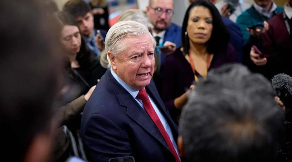 Sen. Lindsey Graham (R-SC) speaks to reporters after Secretary of War Pete Hegseth and Secretary of State Marco Rubio attend closed door meetings with lawmakers on Capitol Hill on December 16, 2025 in Washington, DC. (Getty Images via AFP) 