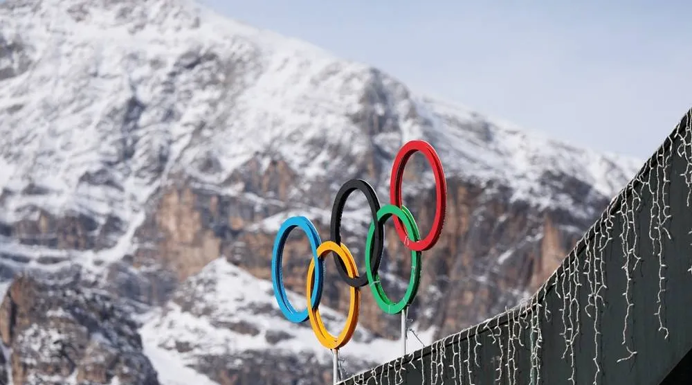 A general view shows the Olympic rings on the Cortina Curling Olympic Stadium, which will host the curling, wheelchair curling, and Paralympic closing ceremony during the Milano Cortina Winter Olympic Games 2026, in Cortina, Italy, January 25, 2025. (Reuters)