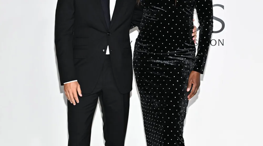 نجمة التنس الأميركية فينوس ويليامز وزوجها أندريا بريتي (أ.ب)