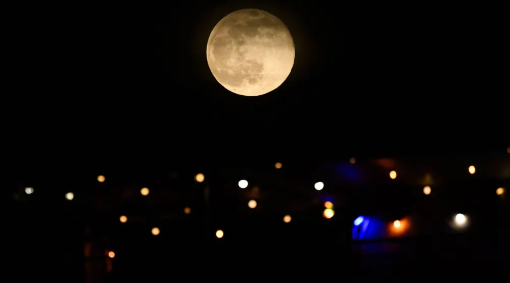 November's full moon, also known as Beaver Moon, rises over Fort-de-France in the French overseas island of Martinique, on November 5, 2025. (AFP)