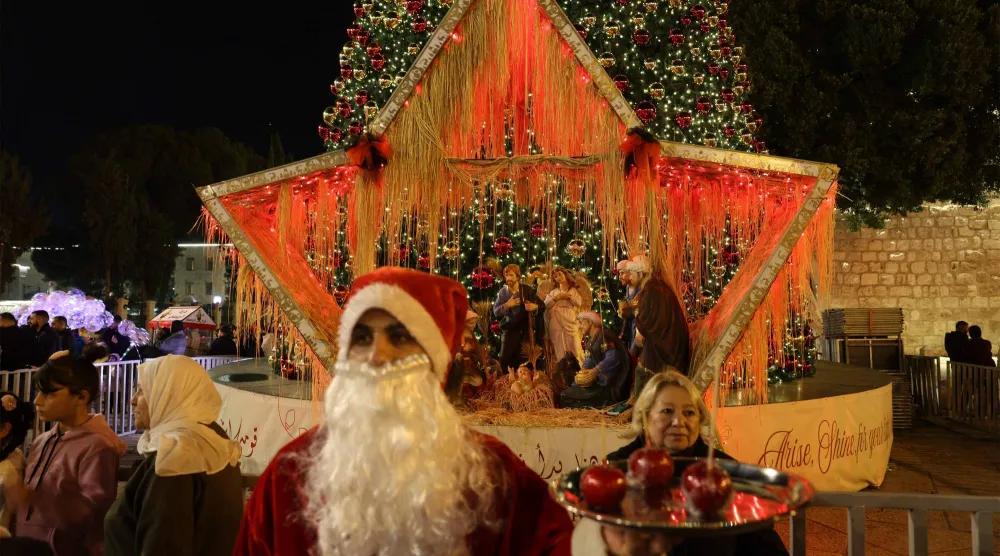 احتفالات عيد الميلاد في بيت لحم بالضفة الغربية (أ.ف.ب)