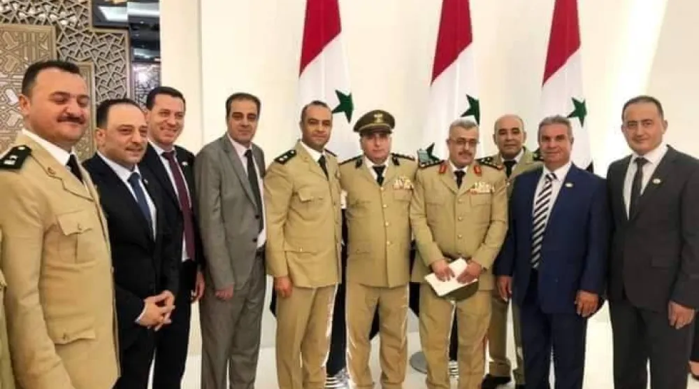 ‏العميد الركن غياث دلا قائد قوات الغيث (الثالث إلى من اليمين) من بين الحضور في أداء القسم الرئاسي صيف 2021